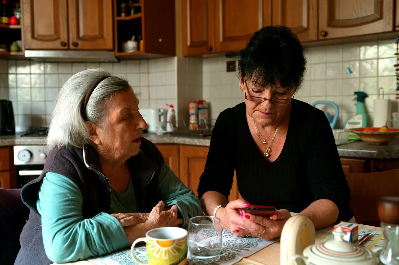 Adult daughter with her elderly mother