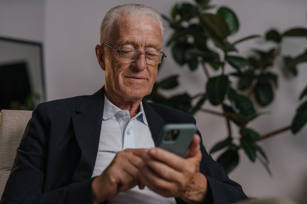 Senior man smiling while talking on the phone